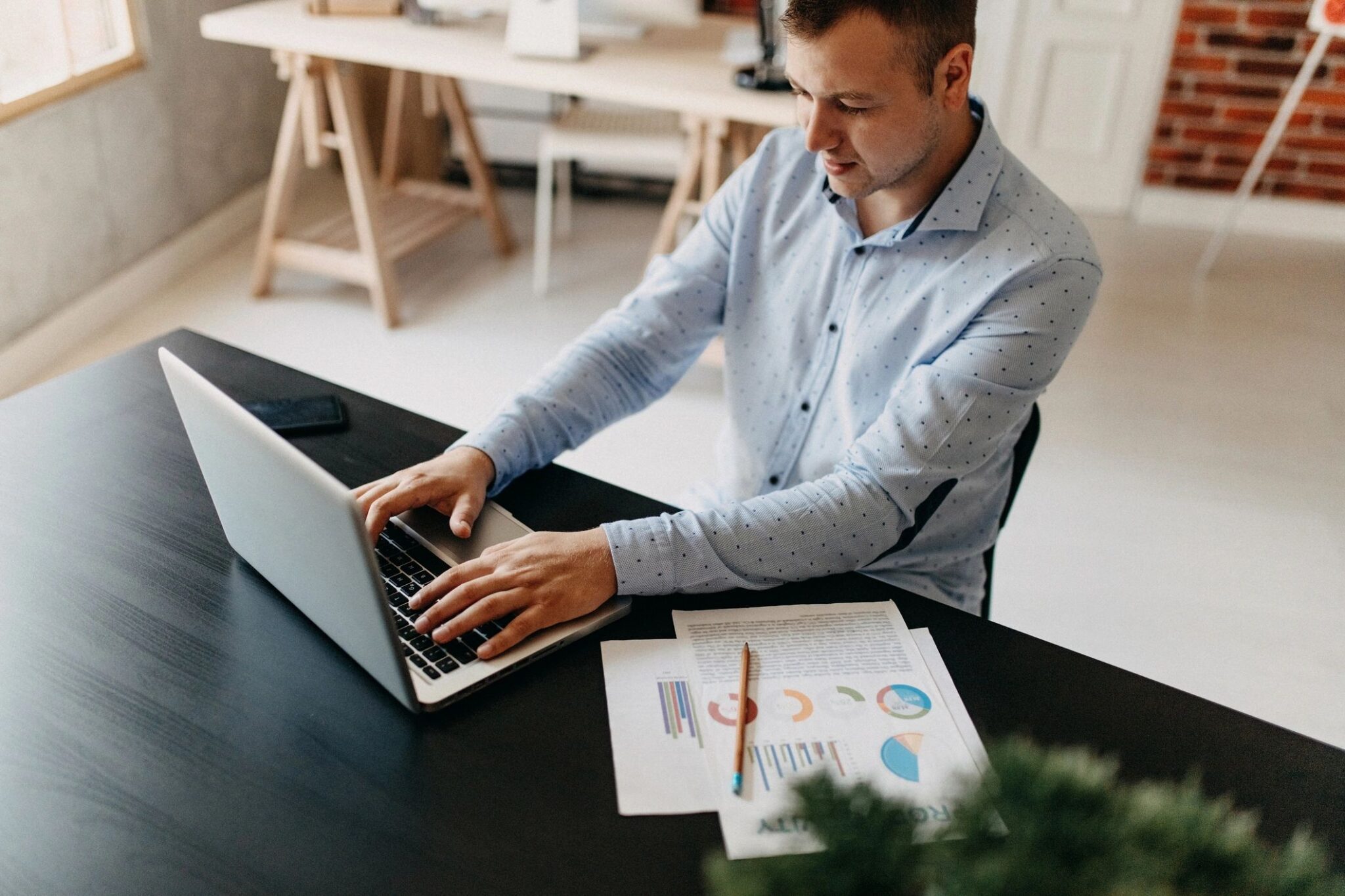 Man working on laptop at desk